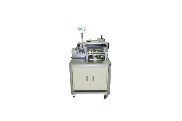 Tape Sticking M/C